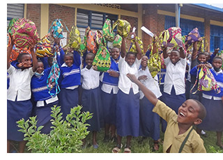 Teenage girls receiving their kits in Rwanda