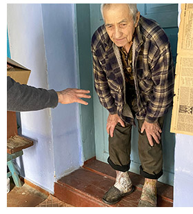 Vasali receiving an aid box.