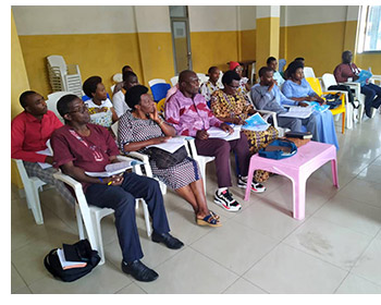 Senior pastors and their wives attending a training course.